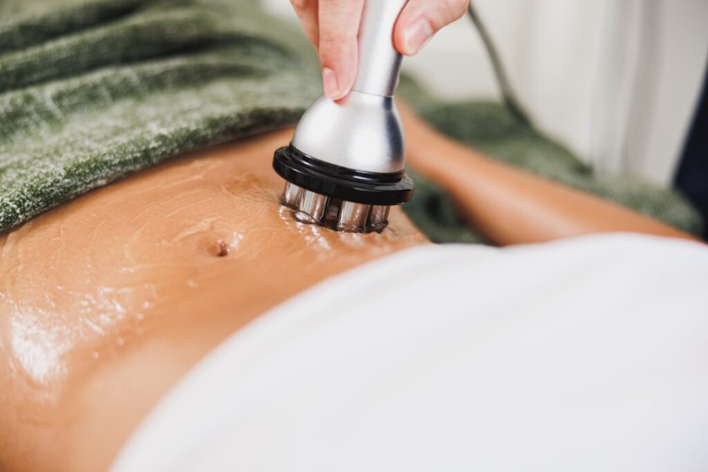 Med spa owner reviewing Google Ads quality score dashboard on laptop to lower cost per click