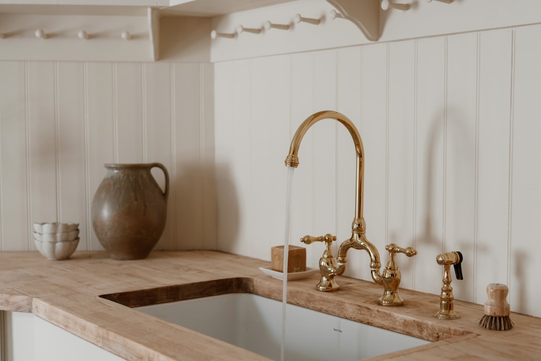 Brushed brass skincare product bottles illustrating the premium med spa market tracked in AI search statistics for med spas 2026