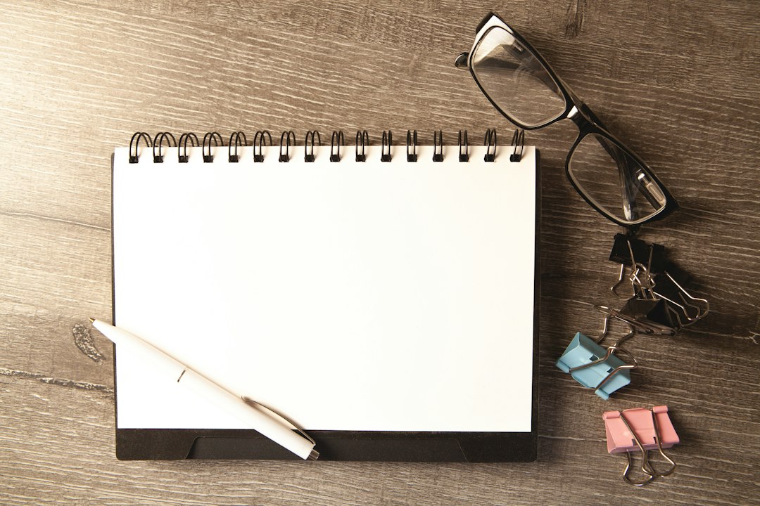Clean desk with notepad and pen for med spa competitor analysis planning