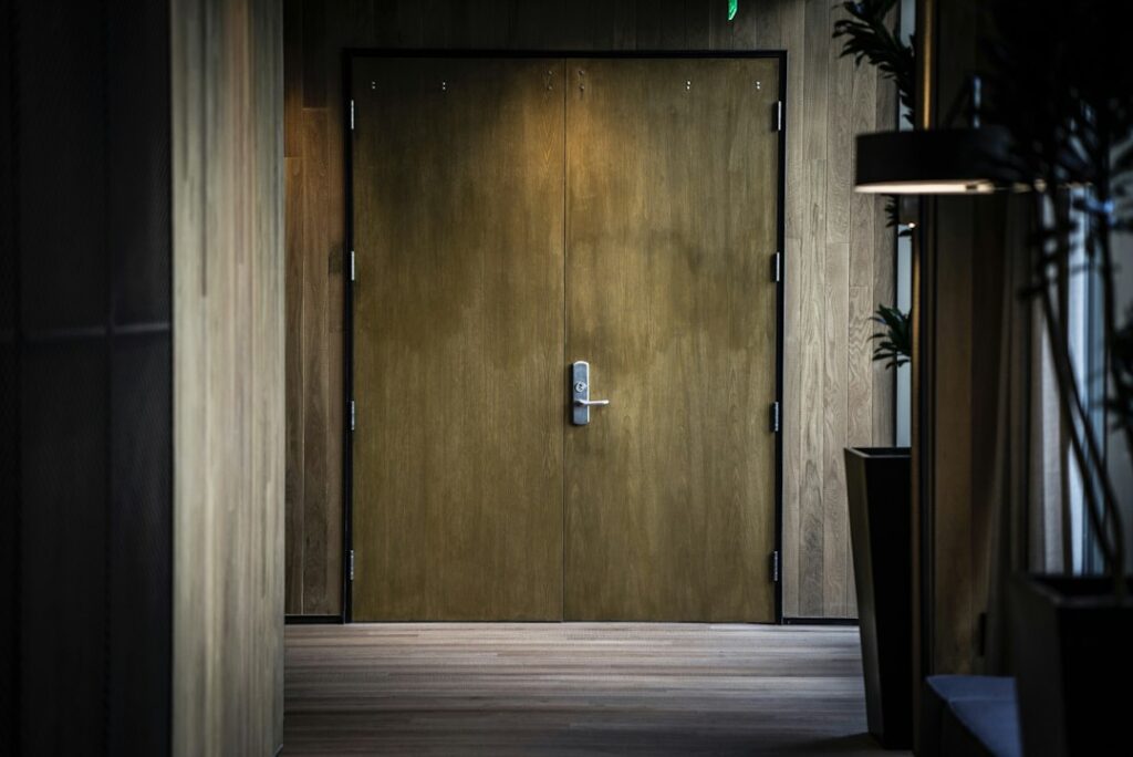 Brass door handle on a luxury interior door, representing the med spa marketing agency red flags that keep owners locked into bad contracts