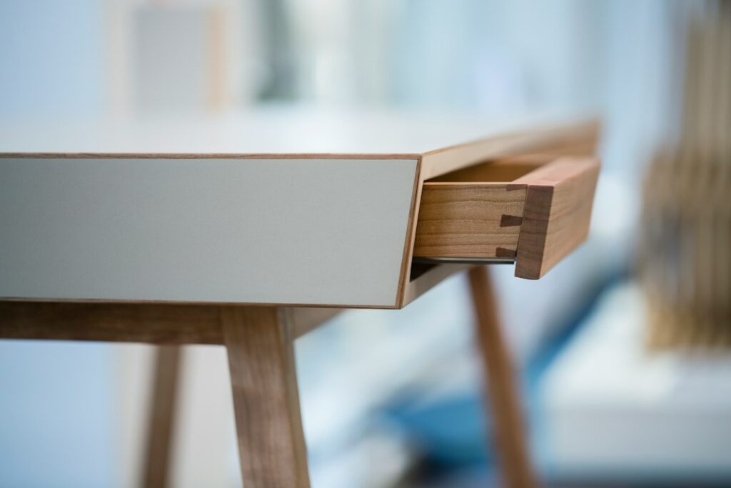 Brushed brass desk detail representing precision and accountability in med spa Google Ads conversion tracking